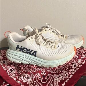 Hoka Cream and Orange Athletic Shoes